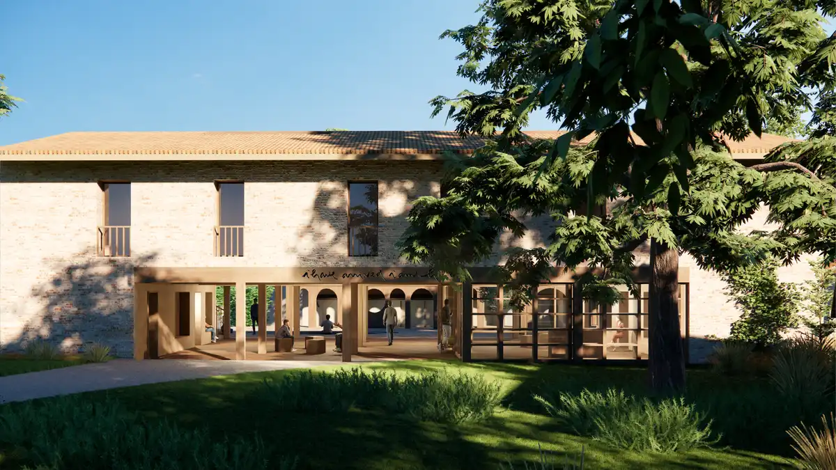 Rendering of the Plum Village architectural project’s new nunnery in Dordogne, France, featuring a stone facade, timber veranda, and integrated greenery under a clear sky.