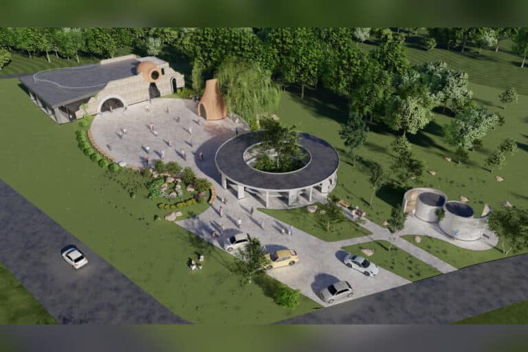 Aerial rendering of Aratta Garden near Khor Virap, Armenia, showcasing four symbolic structures a restaurant, bakery, market, and restroom — arranged around an elliptical public square with greenery, pathways, and parked cars.