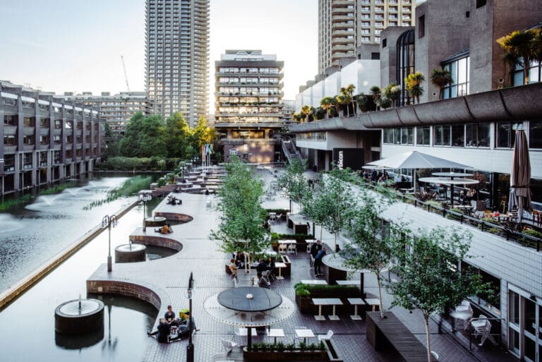 Barbican Centre public terrace with water features and Brutalist legacy architecture in London