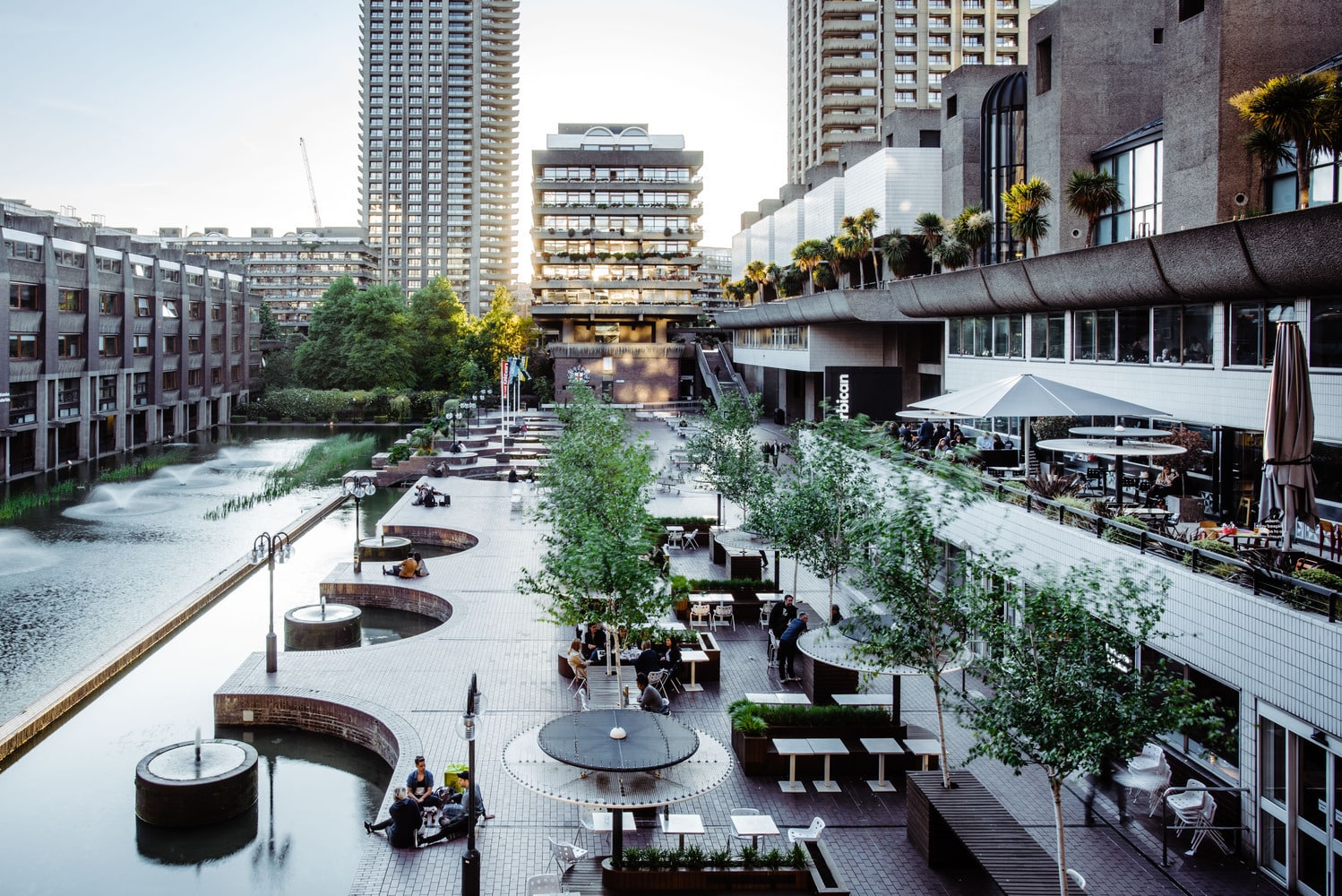 Barbican Centre public terrace with water features and Brutalist legacy architecture in London