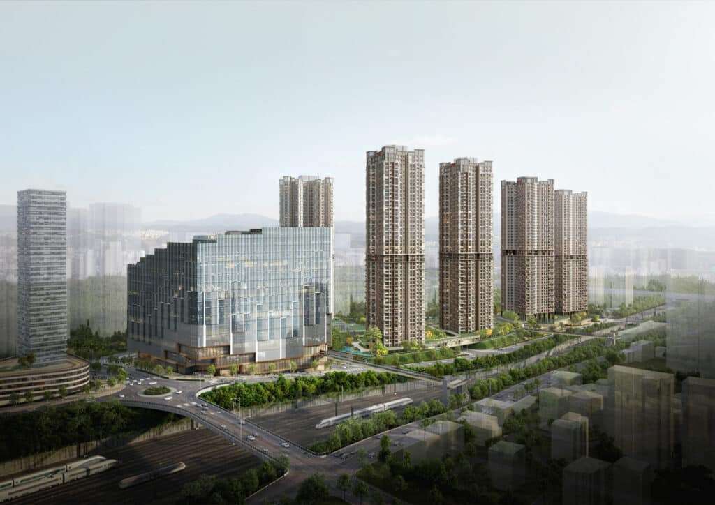 Stepped glass mass and tall residential buildings overlook the railway lines and surrounding districts.