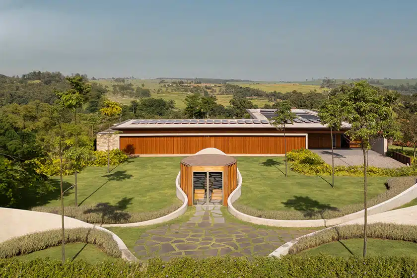 curving concrete walls encircle nest chapel&rsquo;s intimate timber core in s&atilde;o paulo