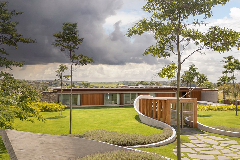 curving concrete walls encircle nest chapel&rsquo;s intimate timber core in s&atilde;o paulo