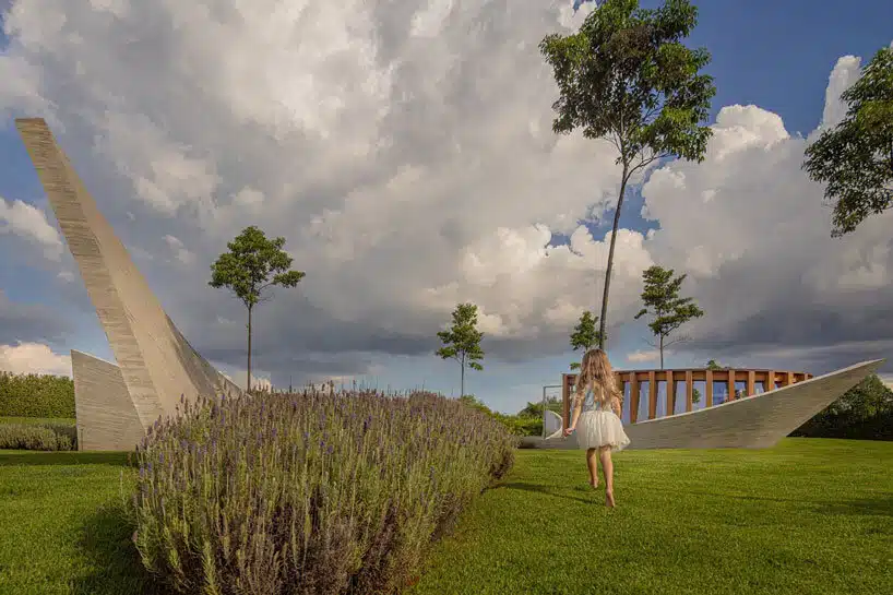 curving concrete walls encircle nest chapel&rsquo;s intimate timber core in s&atilde;o paulo