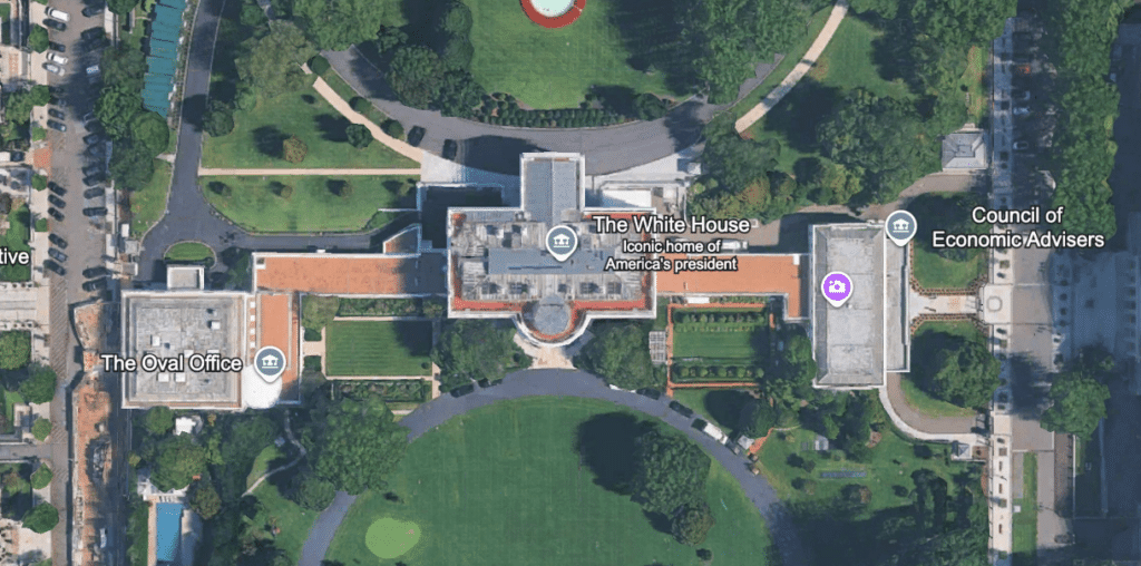 Aerial view showing the urban gradient of the Presidential complex and elongated wing structure.