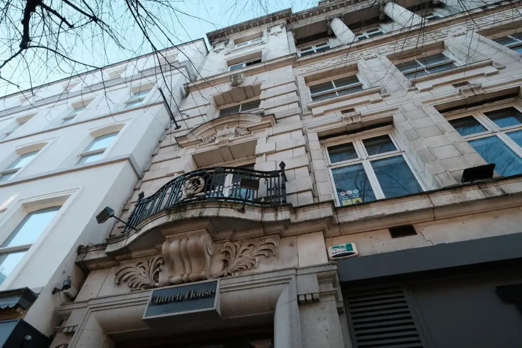 Detailed shot of the stone entrance of Church House on Deansgate, Manchester, the target site for the Architectural Regeneration in Manchester plan.