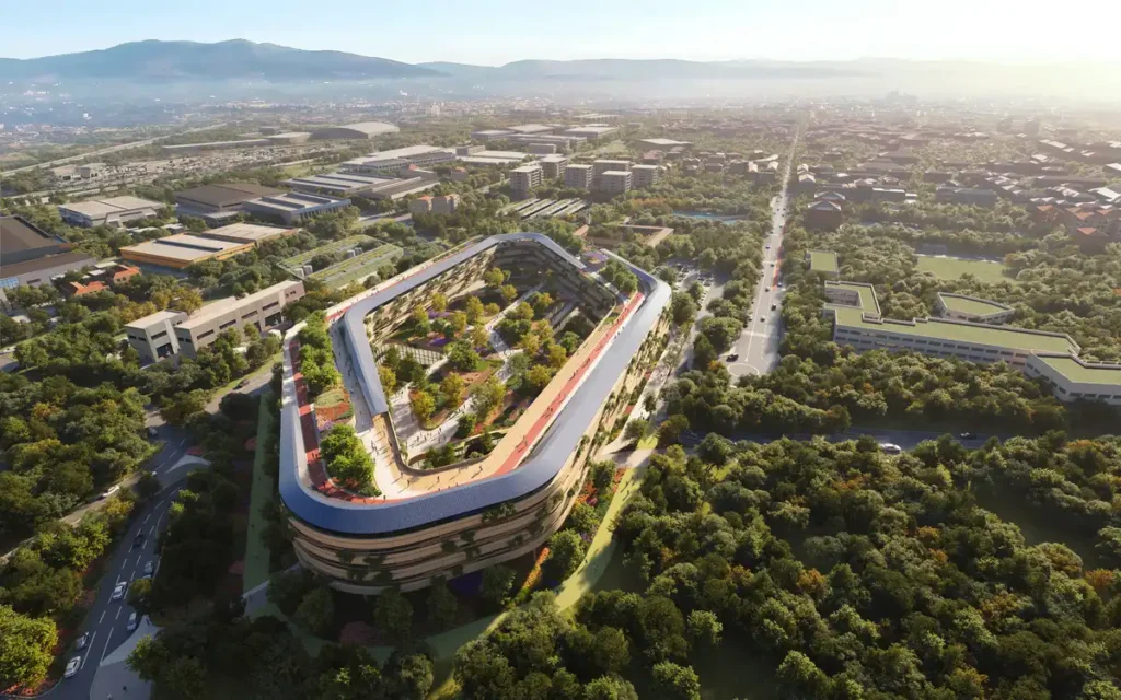 Malpensa Hospital in Milan by Zaha Hadid, showing the integrated medical campus from above with surrounding greenery and urban infrastructure.