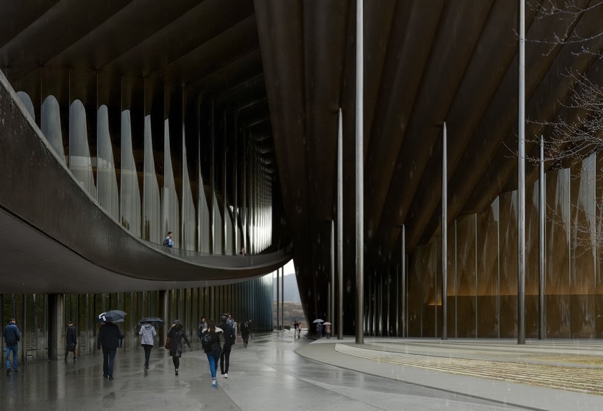 Ulsan Performing Arts Venue interior view showing curved walkway and vertical light elements under a layered canopy. The architectural design integrates movement and transparency.