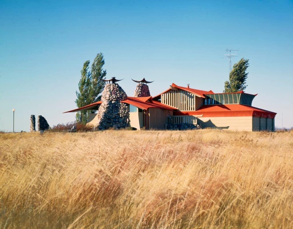 Interior view of Bruce Goff’s avant-garde material installation at the Art Institute of Chicago, featuring dynamic forms, layered textures, and vibrant color contrasts.