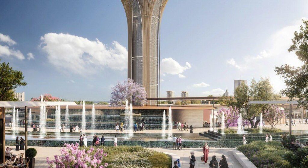 Rendered public plaza with a perforated-lattice tower, tiered fountains, landscaped gardens, and shaded walkways in a Gulf coastal setting.