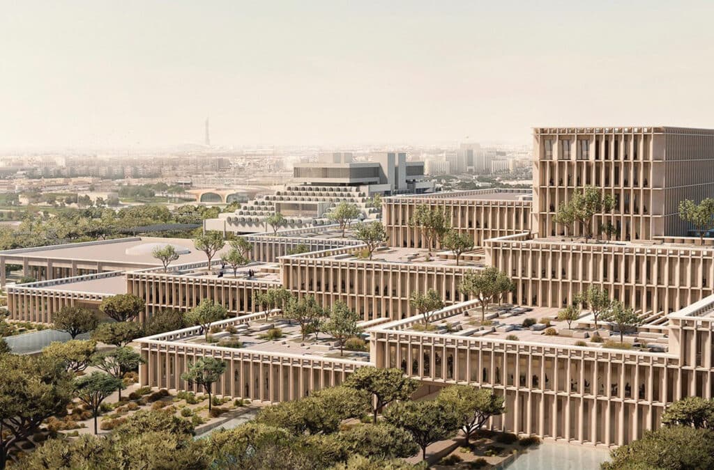 منظور جوي يوضح تداخل الكتل المتدرجة والأشجار المحلية التي تكسو الأسطح للمساهمة في تلطيف المناخ.