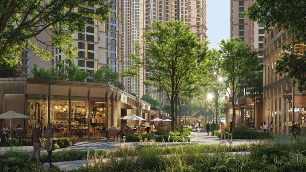 Ground-level storefronts open onto a wide pedestrian plaza surrounded by shaded trees.