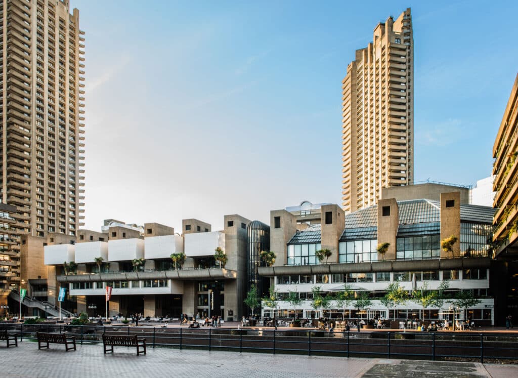 Barbican Centre exterior view with residential towers and public plaza under clear sky