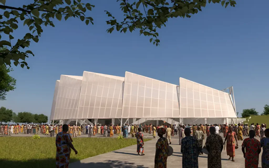 Crowd moves toward the bright white facade under a clear blue sky