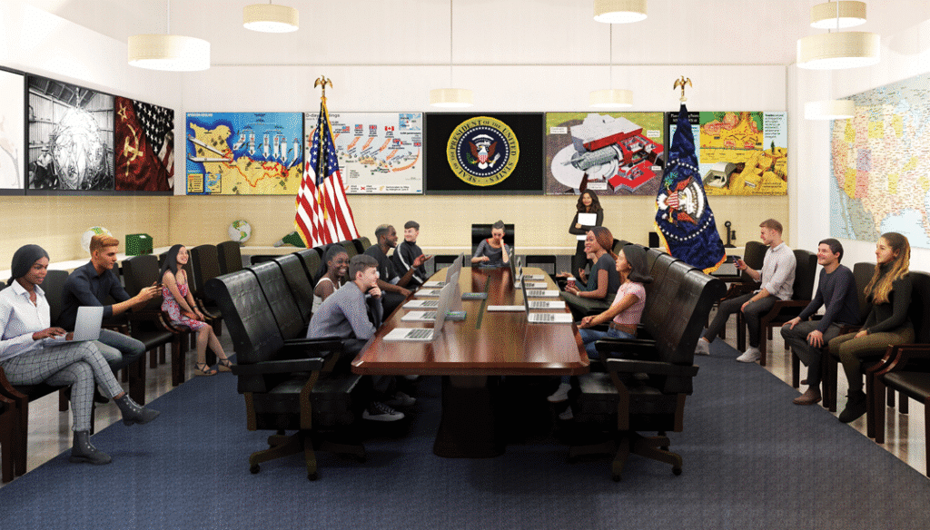 Trainees analyze strategic scenarios around a long table amid maps and flags.