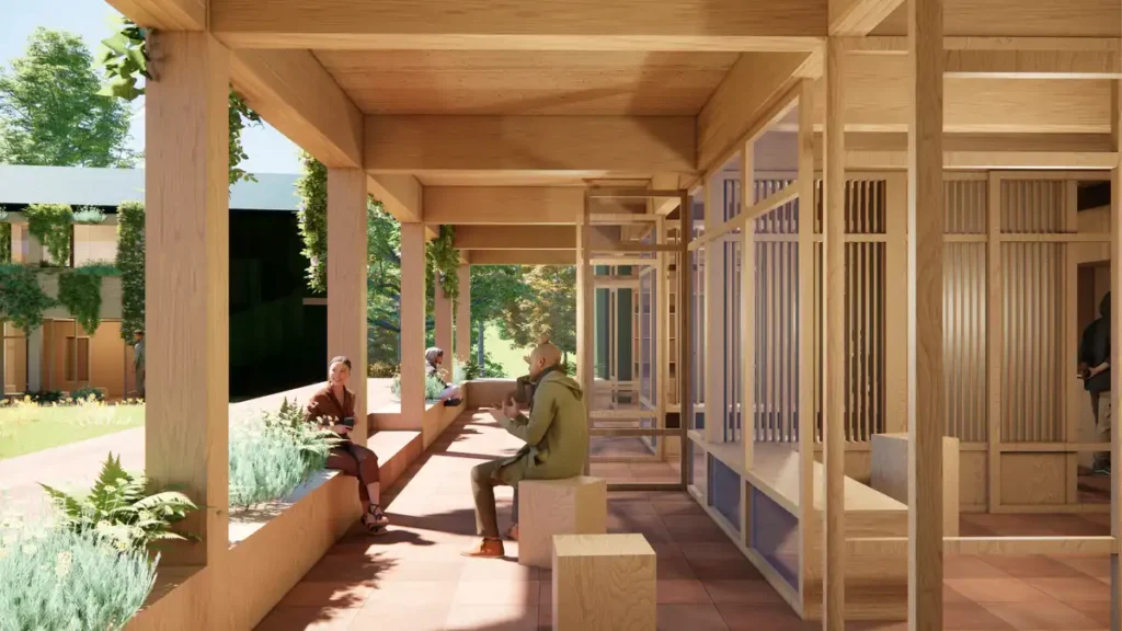 Rendering of the Plum Village architectural project&rsquo;s communal veranda in Dordogne, France, showing timber structure, terracotta flooring, and visitors engaging in quiet conversation with garden views.