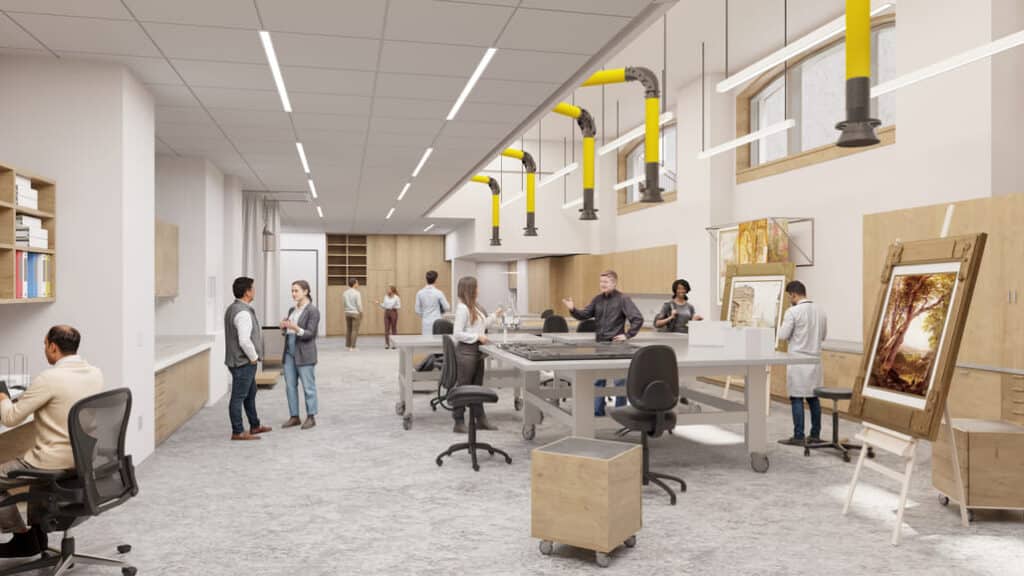 مختبر ترميم فني في جناح تانغ، مجهز بطاولات قابلة للحركة وأدوات متخصصة، يعكس التصاميم المعمارية التي تدعم العمل الفني الدقيق والتعاون بين المتخصصين.