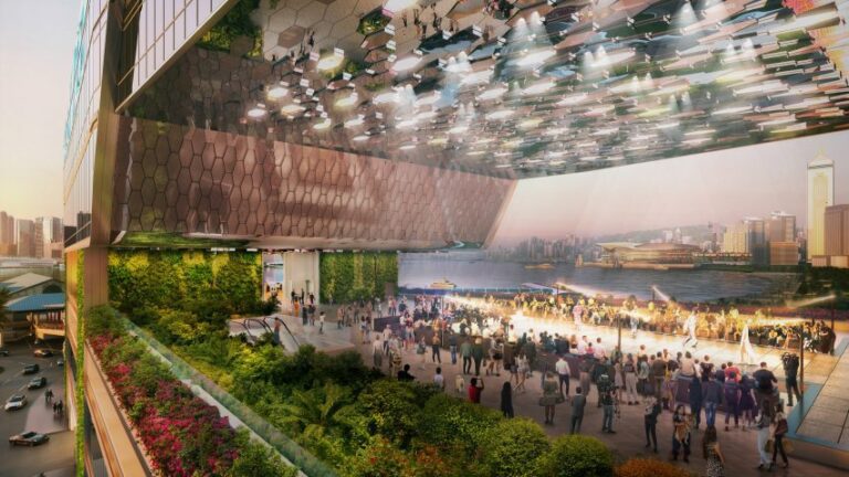 Rendered view of the Central Yards Hong Kong waterfront development, showcasing a multi-level public plaza with greenery, a large digital canopy, and views of Victoria Harbour and the city skyline.