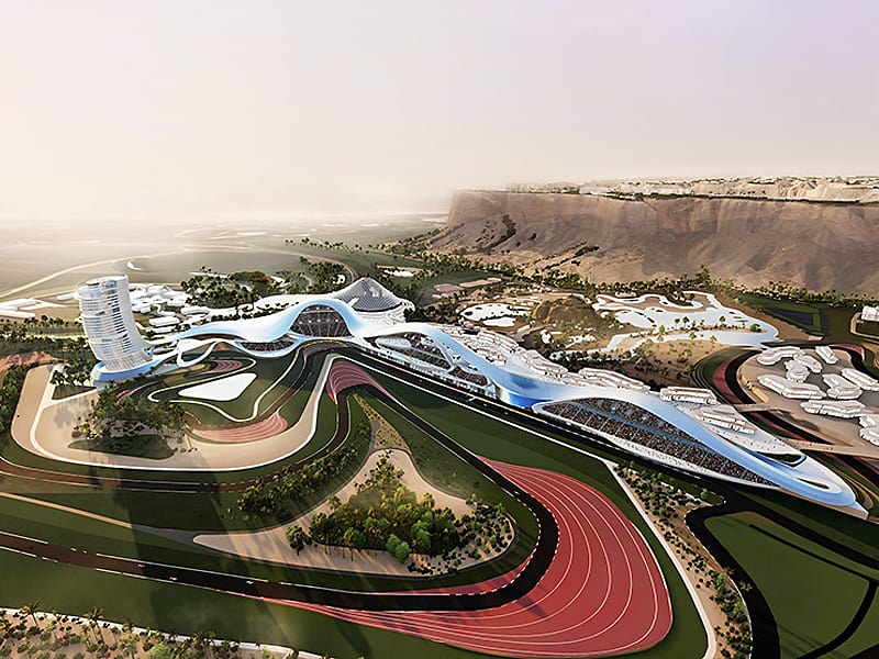Aerial rendering of Qiddiya&rsquo;s motorsport district featuring a curving racetrack, spectator stands, and sculptural buildings integrated into desert terrain.