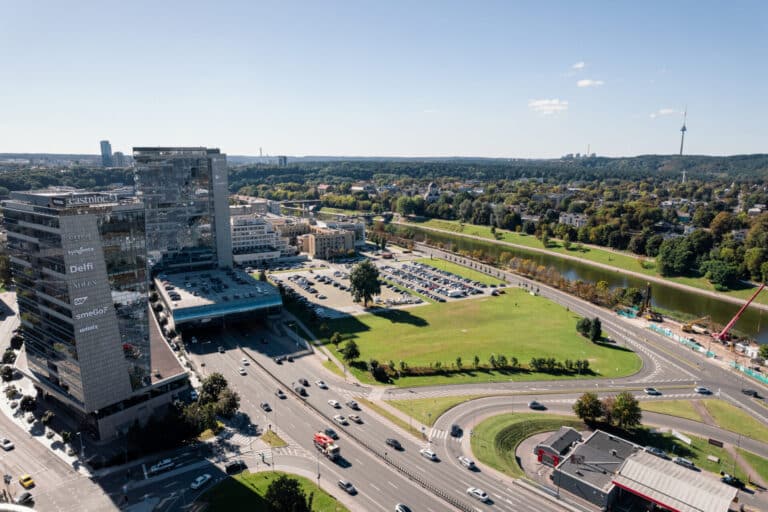 Aerial view of the site context in Vilnius where the Vilnius Congress Centre design competition will take place, showing existing surroundings and urban fabric next to the Lithuanian Parliament.