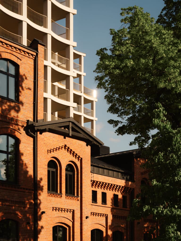Interior/exterior architectural detail of the Nowy Port Bydgoszcz project showing built form and material expression.