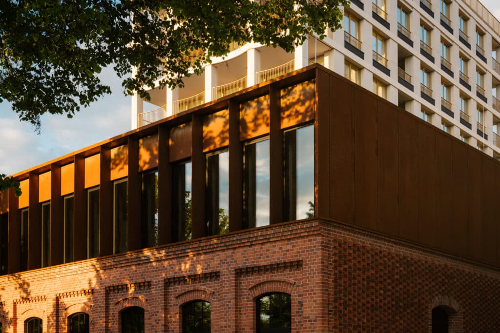 Architectural view of the Nowy Port Bydgoszcz residential and urban regeneration project showing built structures and waterfront context.