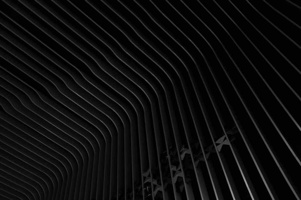 Abstract image featuring a dark, metallic, and patterned design with a captivating texture.