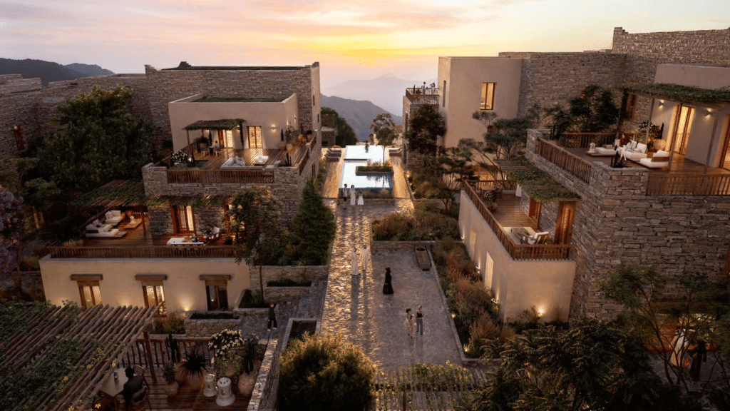 English: Render of Soudah Peaks mountain resort showing traditional stone architecture, infinity pools, and terraced landscapes overlooking the Aseer mountains at sunset.