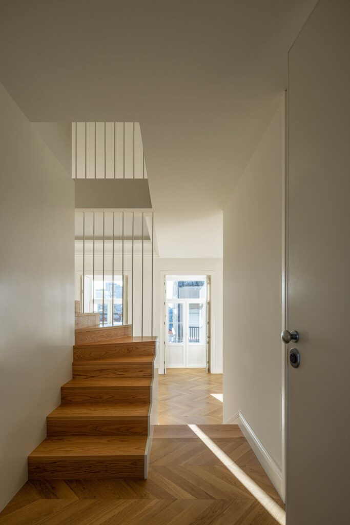 Comprehensive view of Rua de Adolfo Casais Monteiro project, analyzing the integration of historic facade restoration, modern extensions, interior courtyards, green spaces, and residential unit distribution in a four-story building.