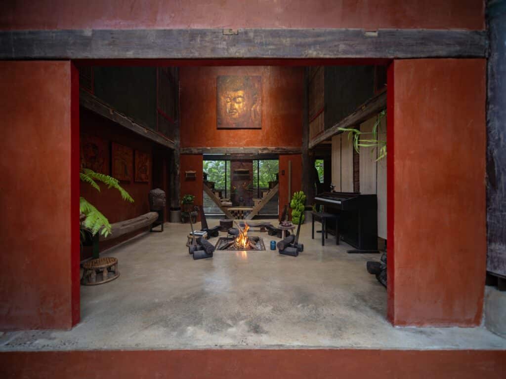 M&Ocirc;he'ritage project in Hanoi combines contemporary architecture with traditional Vietnamese materials, wooden structures, corrugated metal roofs, water features, and heritage fragments, creating a sustainable, culturally rich environment that connects human experience with historical context