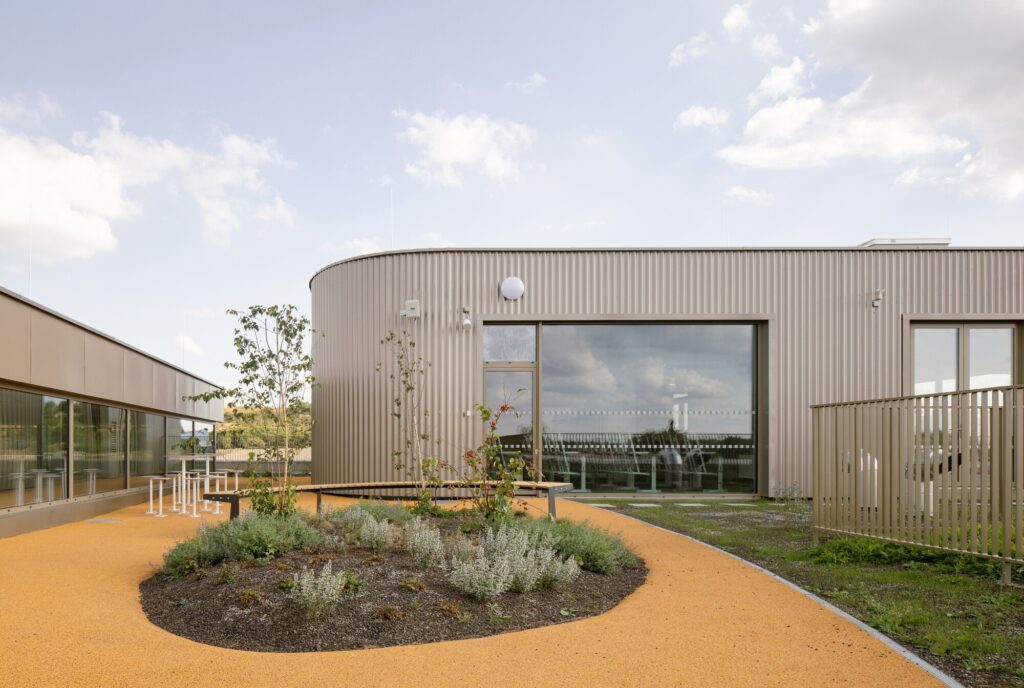 Comprehensive view of Cheneh school project illustrating flexible learning spaces, integrated sports facilities, rooftop classrooms, sustainable design, and interactive educational environments.