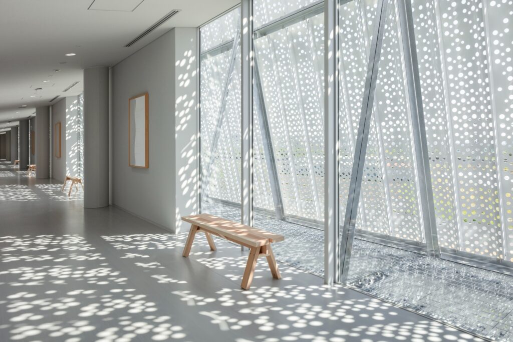 Hair care products factory in Kosatsu, designed to integrate environmental sustainability, YOSHIZU reed screen, water and energy management, with flexible workspaces.