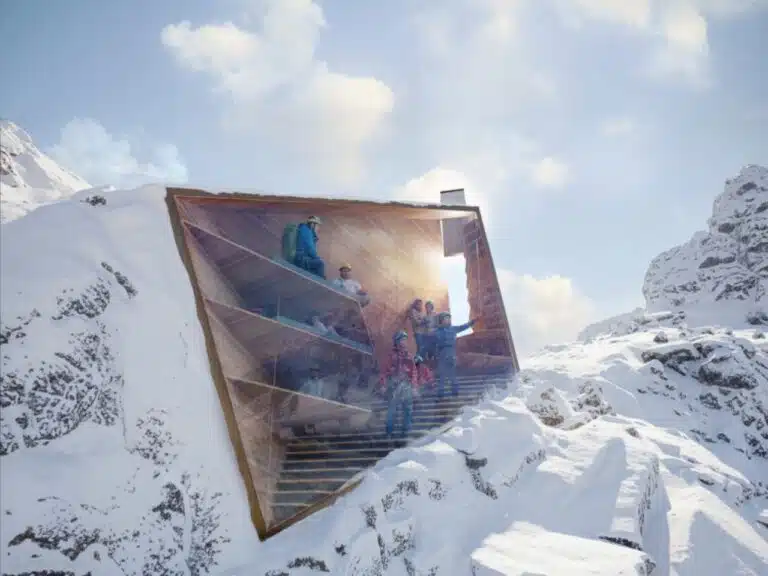 Exterior view of the CRA mountain shelter integrating circular design with the natural Alpine landscape.