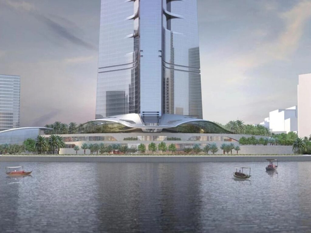 JEC Tower in Jeddah under construction, showcasing its central core, mixed-use spaces including offices, hotel, residential units, and engineering challenges as it rises above 1 kilometer, providing insight into modern skyscraper design and construction techniques