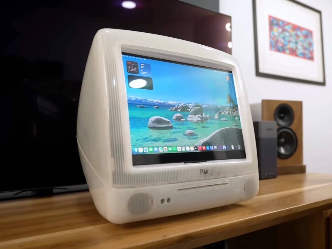 Refurbished Apple iMac G3 featuring original translucent design with modern Mac Mini integration, 4K OLED display, upgraded storage, and enhanced audio system, blending 1990s aesthetics with contemporary performance.