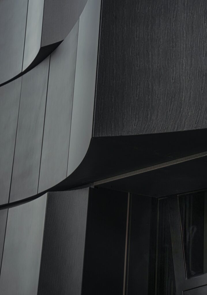 Kalleb&auml;cks Terrasser architectural project exploring the interaction between sculptural building forms, rocky terrain, innovative materials, eco-friendly concrete, and unique interior lighting, offering a comprehensive experience of transitional spaces between nature and architecture.