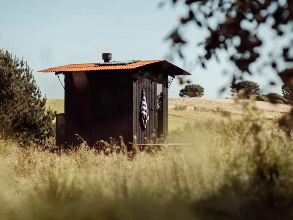 Aquila mobile sauna project showcasing compact Finnish-inspired design, durable materials, solar-powered lighting, and foldable roof for remote locations