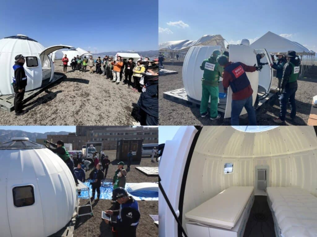 Emergency response teams and volunteers assembling Ezdome units during a field demonstration, including an interior view with two beds.