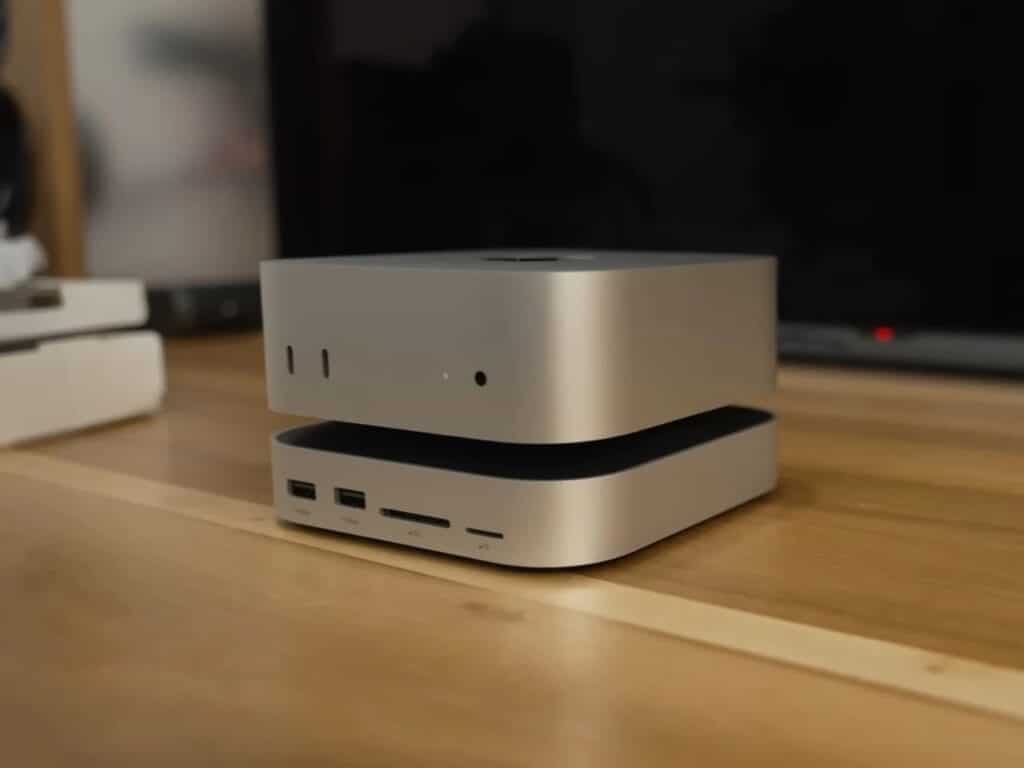 Refurbished Apple iMac G3 featuring original translucent design with modern Mac Mini integration, 4K OLED display, upgraded storage, and enhanced audio system, blending 1990s aesthetics with contemporary performance.