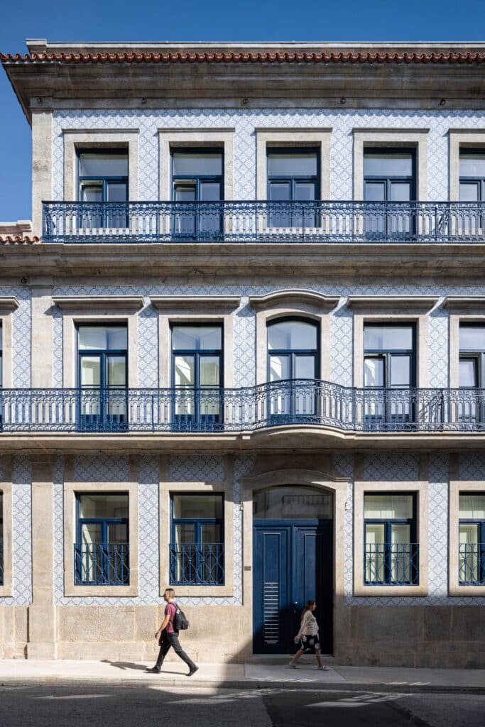 Front facade of Rua de Adolfo Casais Monteiro building showing the four-story structure and restored historic elements.