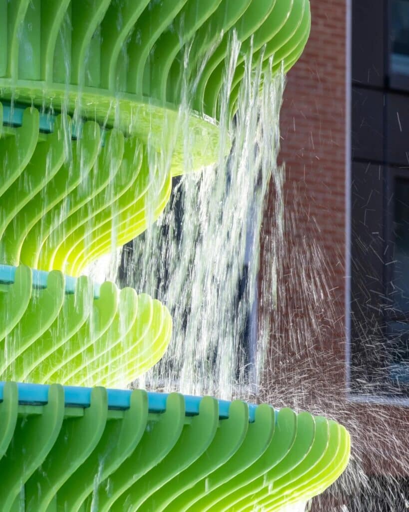 The Fountain in Brent Cross Town, London, is a contemporary and innovative architectural design featuring bright green sculptural panels, unusual angles, and bold colors, combined with frozen water motion to create an interactive visual and sensory experience for visitors, reflecting Neon Studio&rsquo;s philosophy of public art, enhancing local identity and social interaction, while offering a model for redefining fountains in contemporary urban spaces.