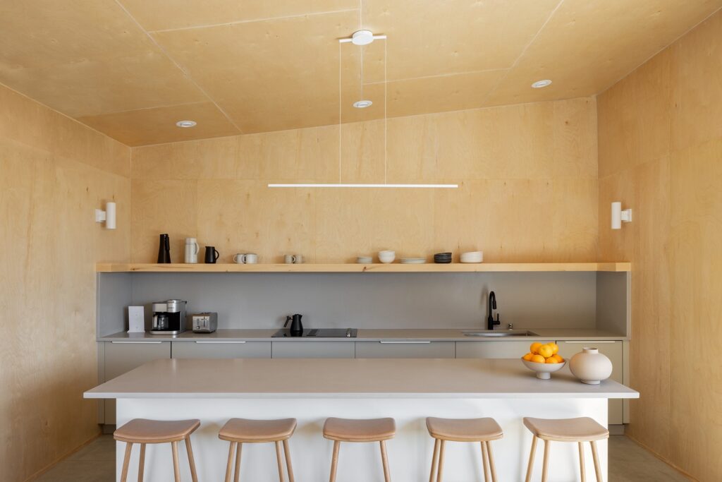 Detailed architectural floor plan of Casa Roca showing the master bedroom, children's bedroom, and open-plan living and kitchen area integrated with a terrace.