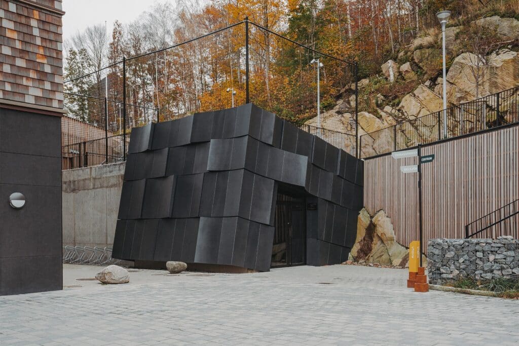 Kalleb&auml;cks Terrasser architectural project exploring the interaction between sculptural building forms, rocky terrain, innovative materials, eco-friendly concrete, and unique interior lighting, offering a comprehensive experience of transitional spaces between nature and architecture.