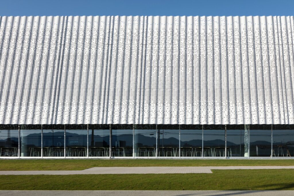 Hair care products factory in Kosatsu, designed to integrate environmental sustainability, YOSHIZU reed screen, water and energy management, with flexible workspaces.