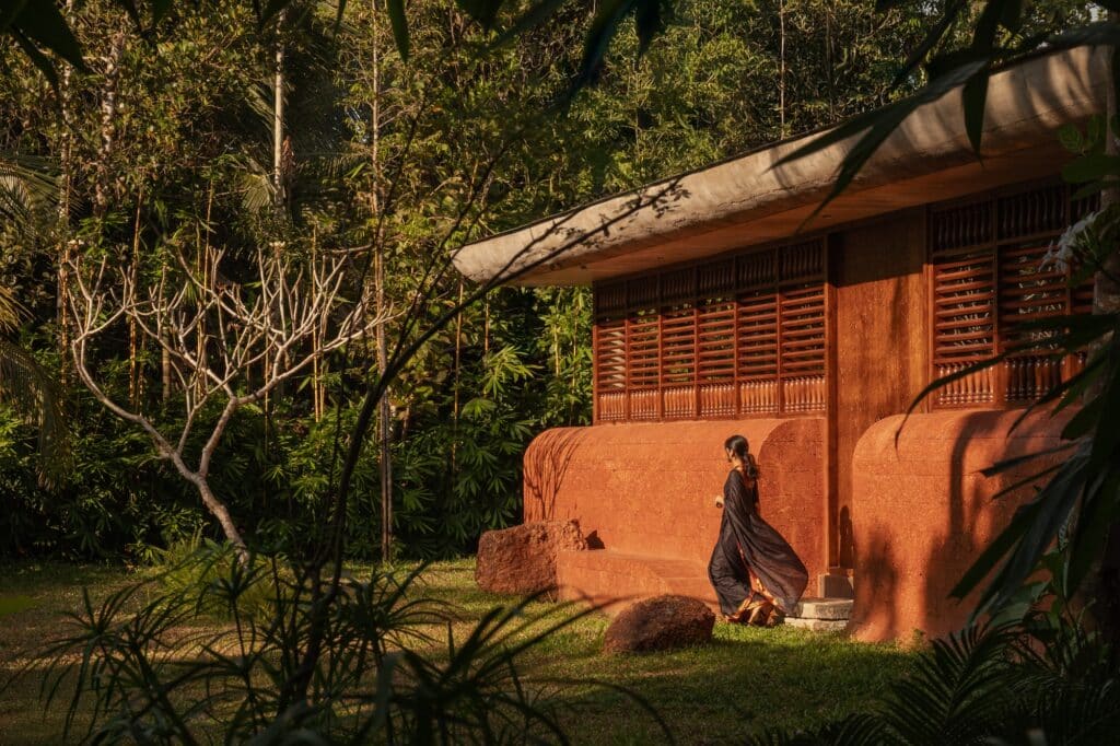 Sumish residence in Bayanur, Kerala, exemplifying the integration of local cultural heritage, traditional architecture, natural materials, open-plan interiors, and sustainable design strategies, harmonizing indoor and outdoor spaces while reflecting the region's spiritual and environmental context.