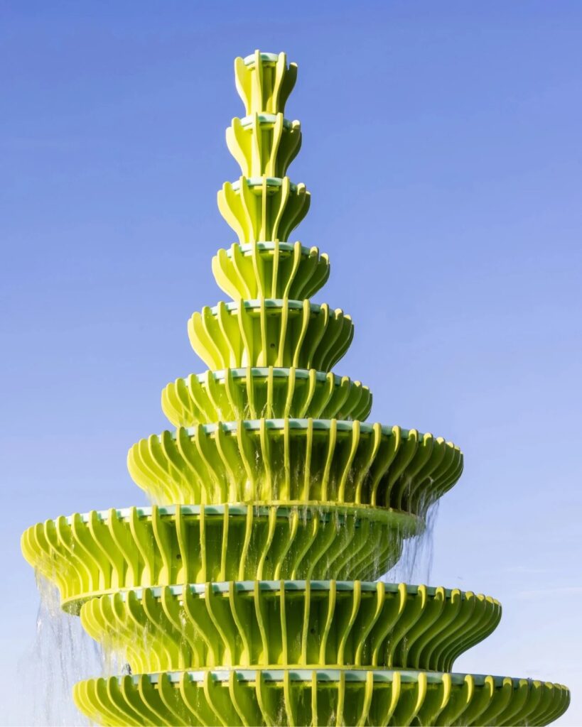 The Fountain in Brent Cross Town, London, is a contemporary and innovative architectural design featuring bright green sculptural panels, unusual angles, and bold colors, combined with frozen water motion to create an interactive visual and sensory experience for visitors, reflecting Neon Studio&rsquo;s philosophy of public art, enhancing local identity and social interaction, while offering a model for redefining fountains in contemporary urban spaces.