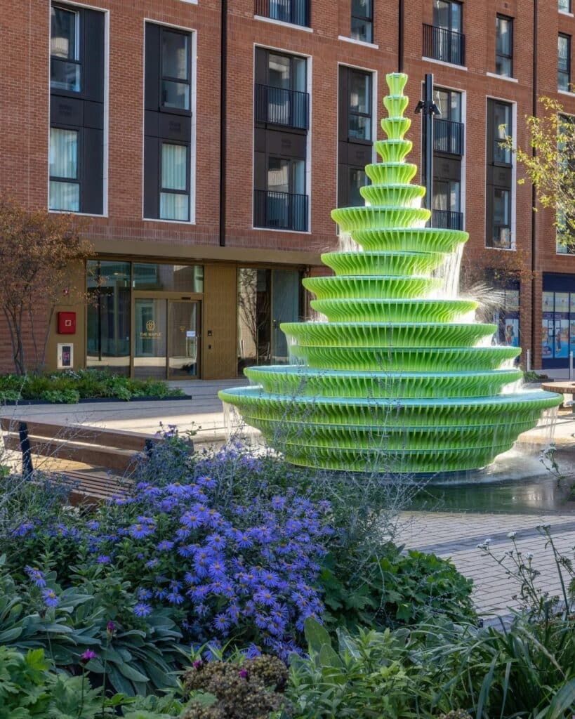The Fountain in Brent Cross Town, London, is a contemporary and innovative architectural design featuring bright green sculptural panels, unusual angles, and bold colors, combined with frozen water motion to create an interactive visual and sensory experience for visitors, reflecting Neon Studio&rsquo;s philosophy of public art, enhancing local identity and social interaction, while offering a model for redefining fountains in contemporary urban spaces.