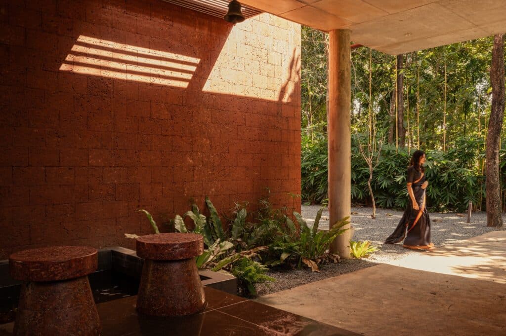 Sumish residence in Bayanur, Kerala, exemplifying the integration of local cultural heritage, traditional architecture, natural materials, open-plan interiors, and sustainable design strategies, harmonizing indoor and outdoor spaces while reflecting the region's spiritual and environmental context.