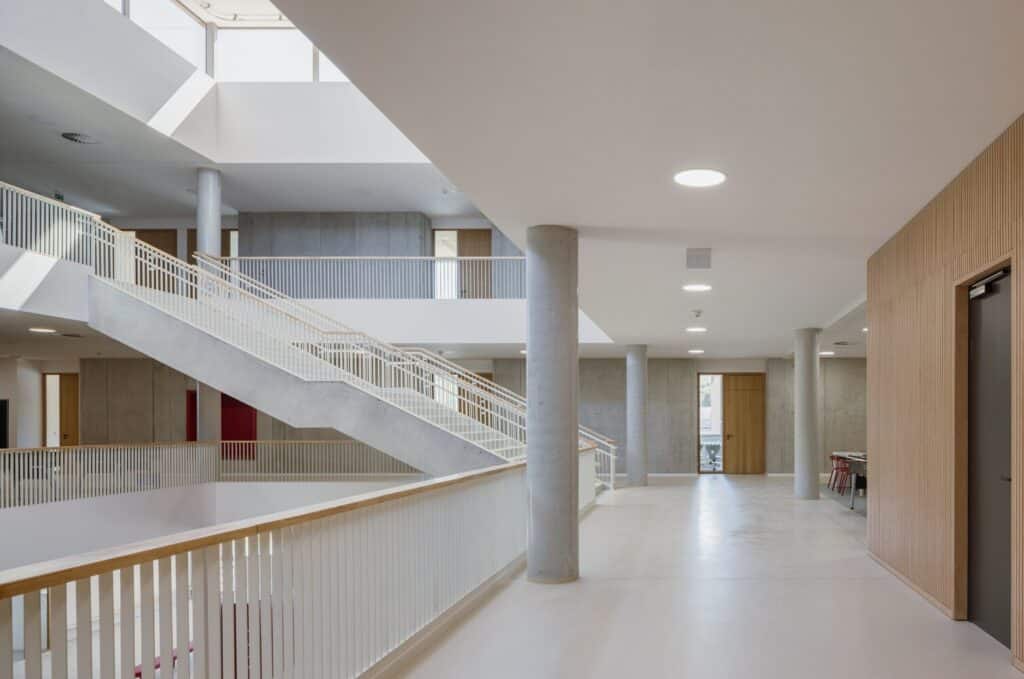 Comprehensive view of Cheneh school project illustrating flexible learning spaces, integrated sports facilities, rooftop classrooms, sustainable design, and interactive educational environments.