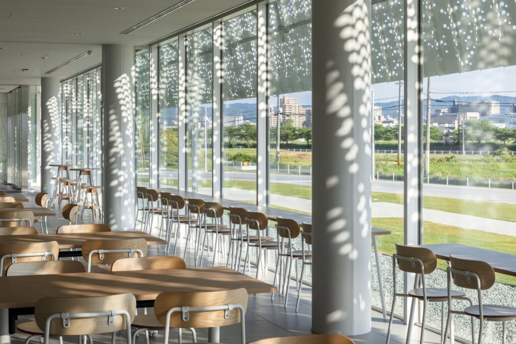 Hair care products factory in Kosatsu, designed to integrate environmental sustainability, YOSHIZU reed screen, water and energy management, with flexible workspaces.
